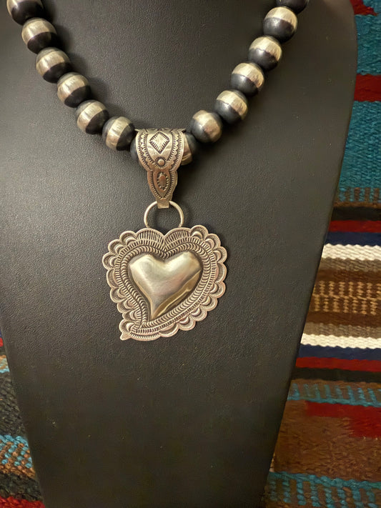 Sterling Silver Repousse Heart Pendant By Leander Tahe